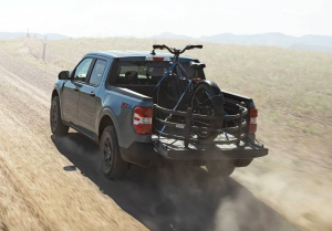 2022 Ford Maverick on dirt road with Outfitted Bike Accessories